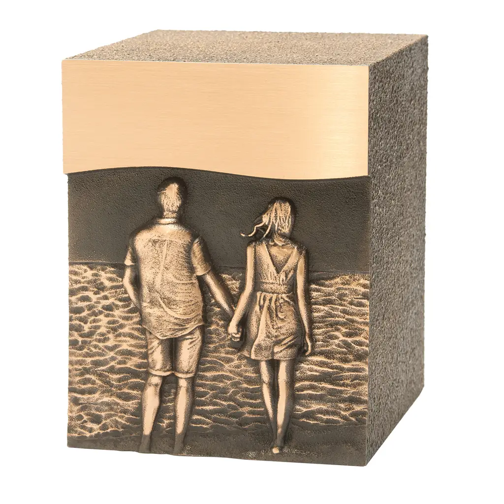 Bronze cremation urn depicting a couple walking hand in hand on the beach, available at Kane Fetterly Funeral Home in Montreal