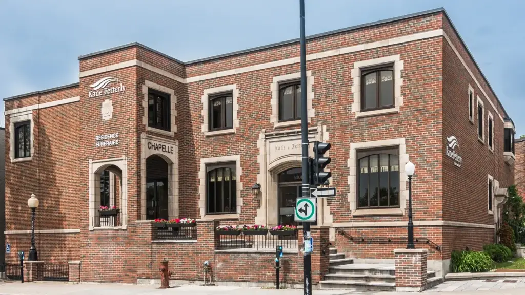 Exterior view of Kane Fetterly Funeral Home in Montreal showing the brick building and main entrance