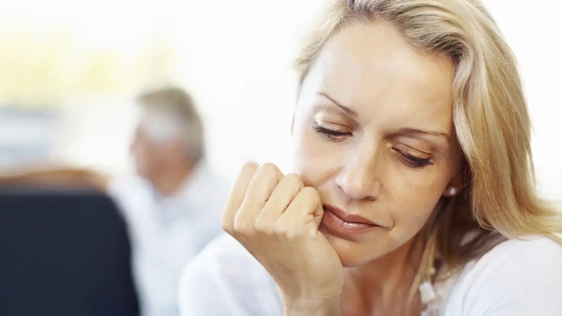 Thoughtful woman reflecting, symbolizing emotional reflection for the article “7 Questions You Should Ask Yourself” from Kane Fetterly Funeral Home in Montreal
