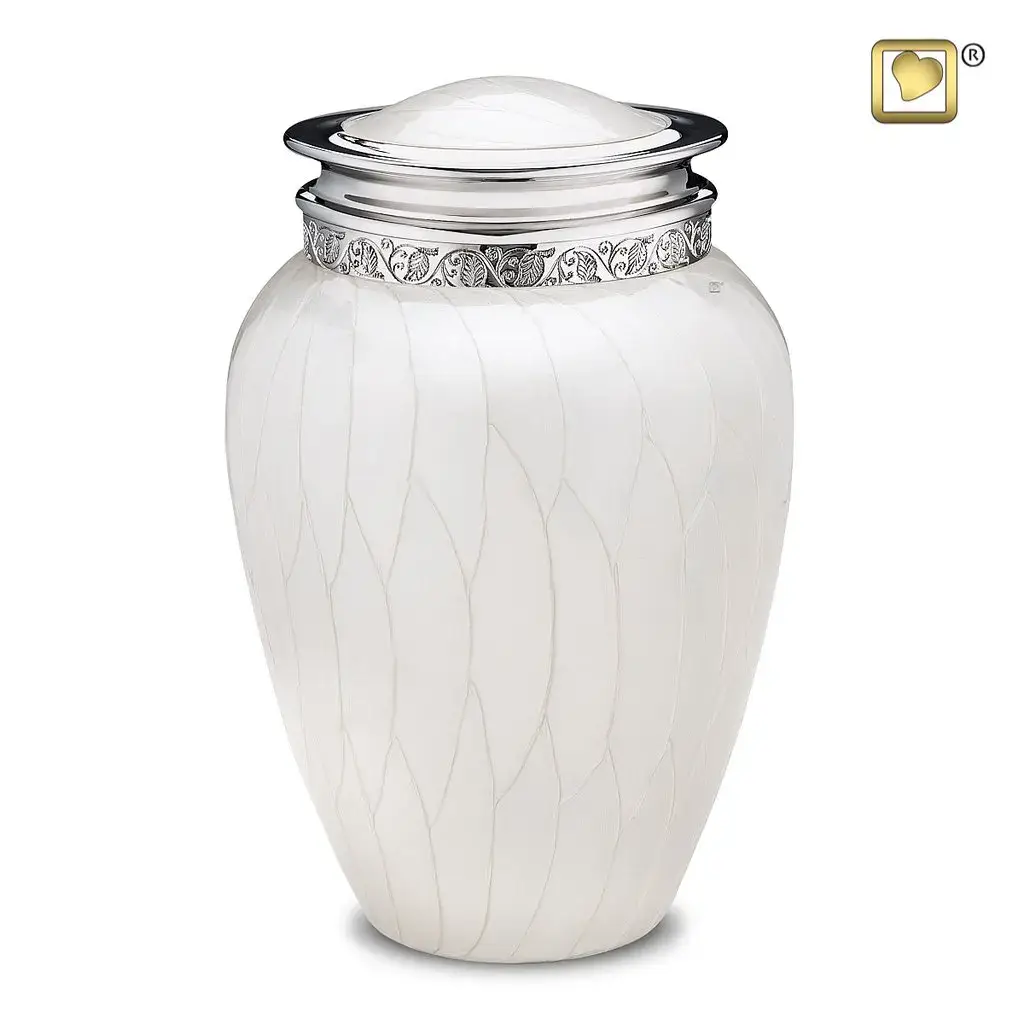 White cremation urn with engraved silver band available at Kane Fetterly Funeral Home in Montreal