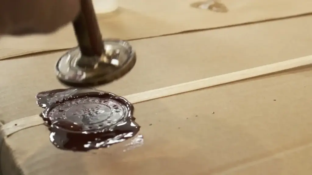 Applying an official wax seal to prepare a casket for repatriation at Kane Fetterly Funeral Home in Montreal, ensuring secure and compliant international transport.